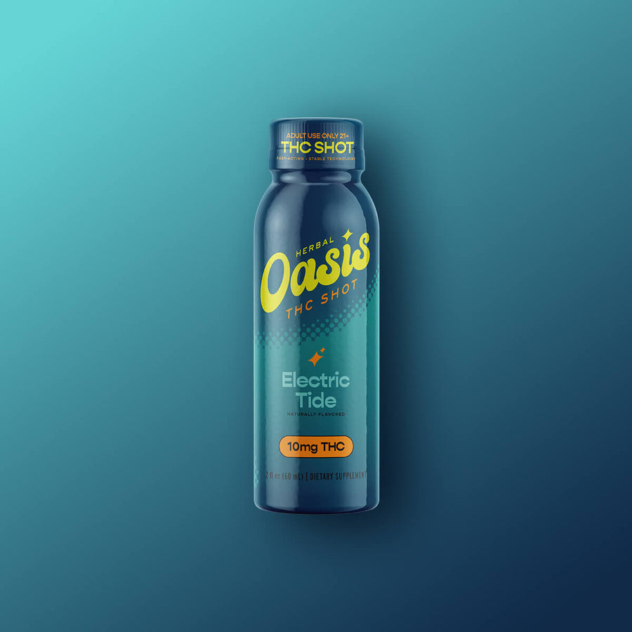 cbdMD Electric Tide 10mg THC shot in a blue bottle against a teal gradient background.