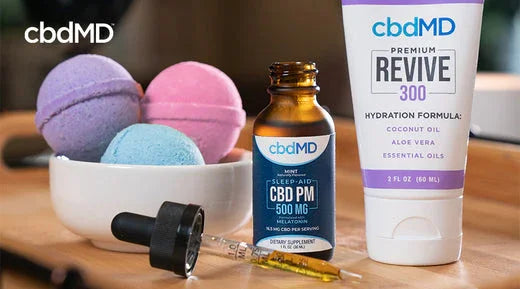 CBD oil dropper, topical cream, and colorful bath bombs for wellness and relaxation