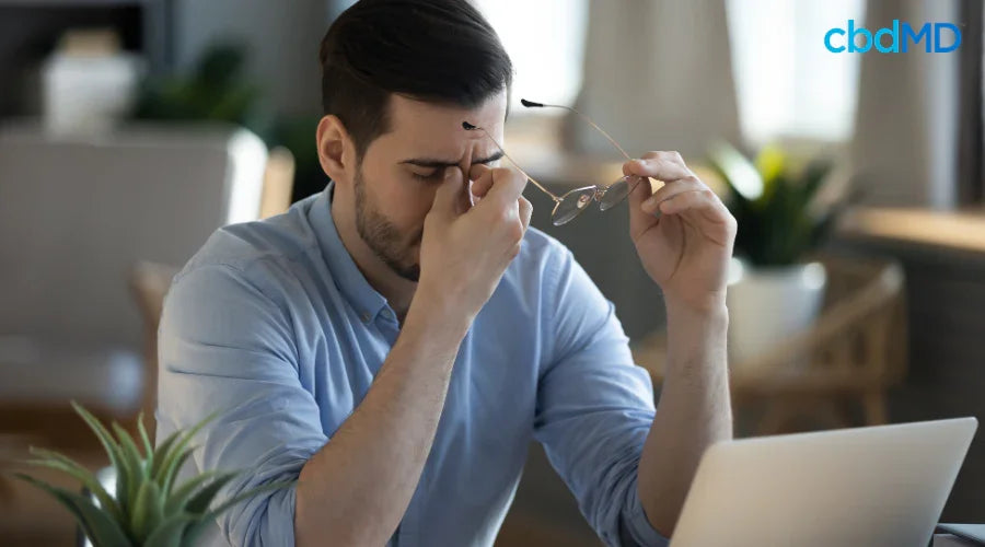 Man at Desk Feeling Stressed