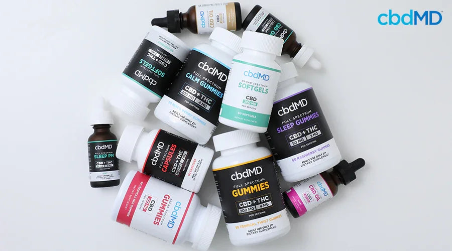 Various strengths of full spectrum and broad spectrum cbd all spread out in a pile - cbdMD