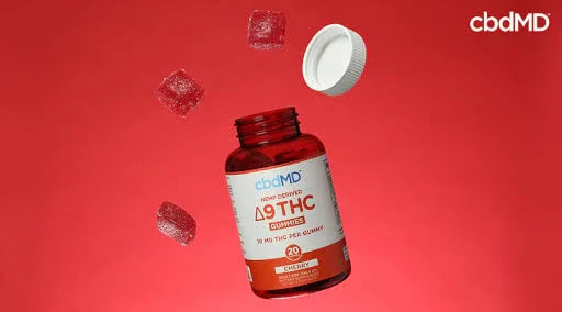 Delta 9 THC gummies bottle with gummies and cap on red background
