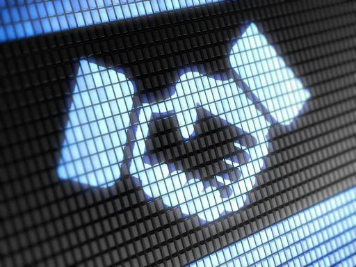 Digital handshake icon on a screen symbolizing online partnership and trust