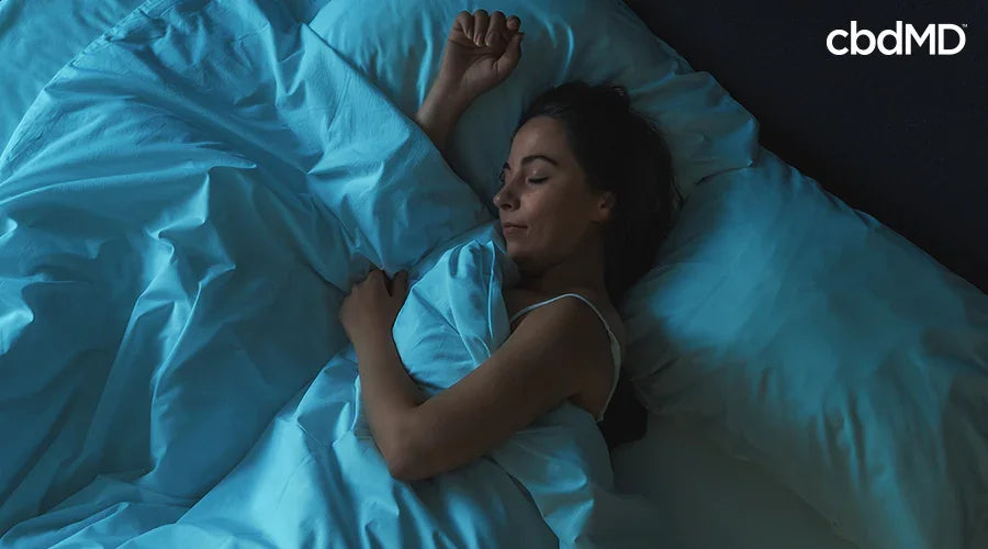 A woman sleeping in a bed