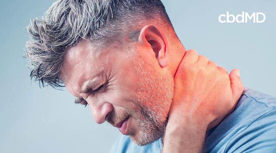 Man holding neck in pain, redness highlighting discomfort, possible relief with CBD products