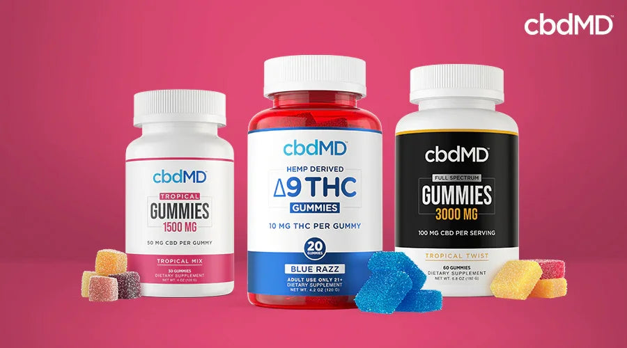Three bottles of CBD gummies and THC gummies with assorted colorful gummy pieces on a pink background.
